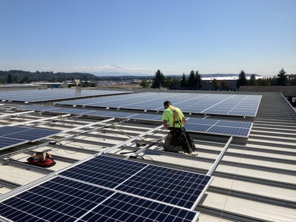 Electrician installing solar panels